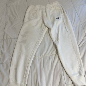 White nike sweatpants tight bottoms. Slight stain on the left leg.